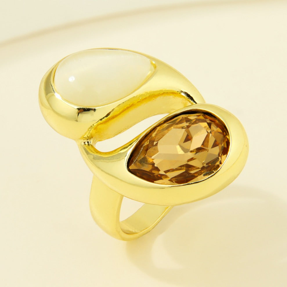 Gold-plated statement ring with cream and amber-colored teardrop accents