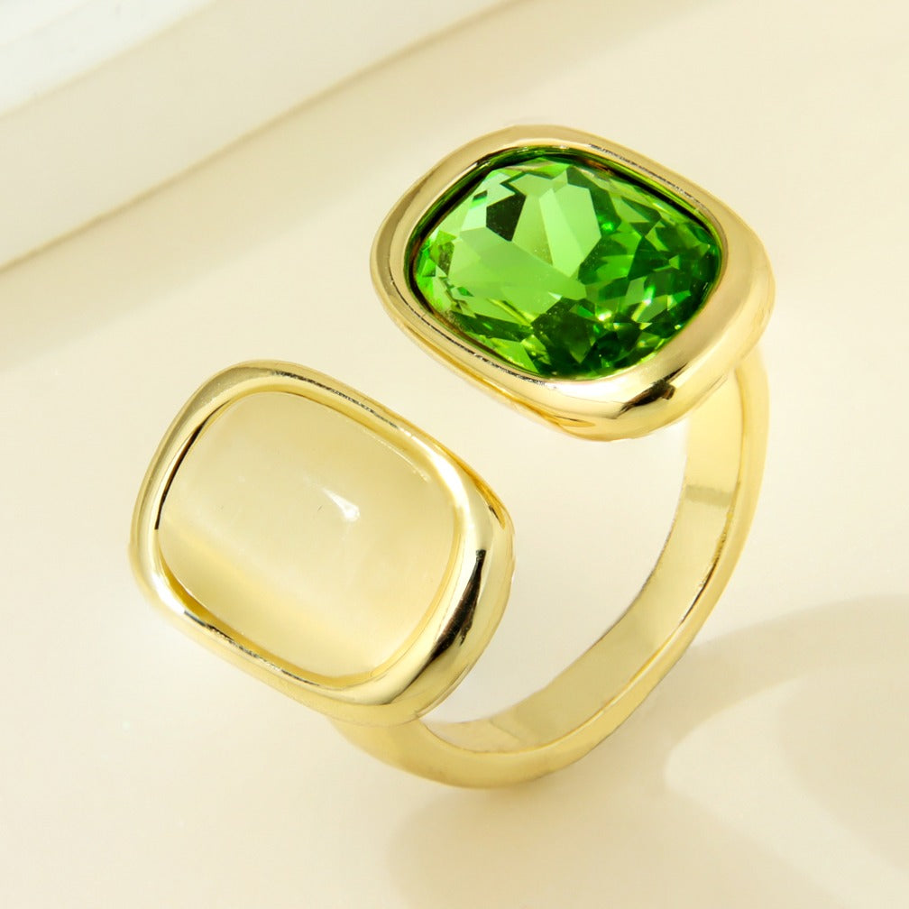 Gold-plated statement ring with cream and green rounded-square accents