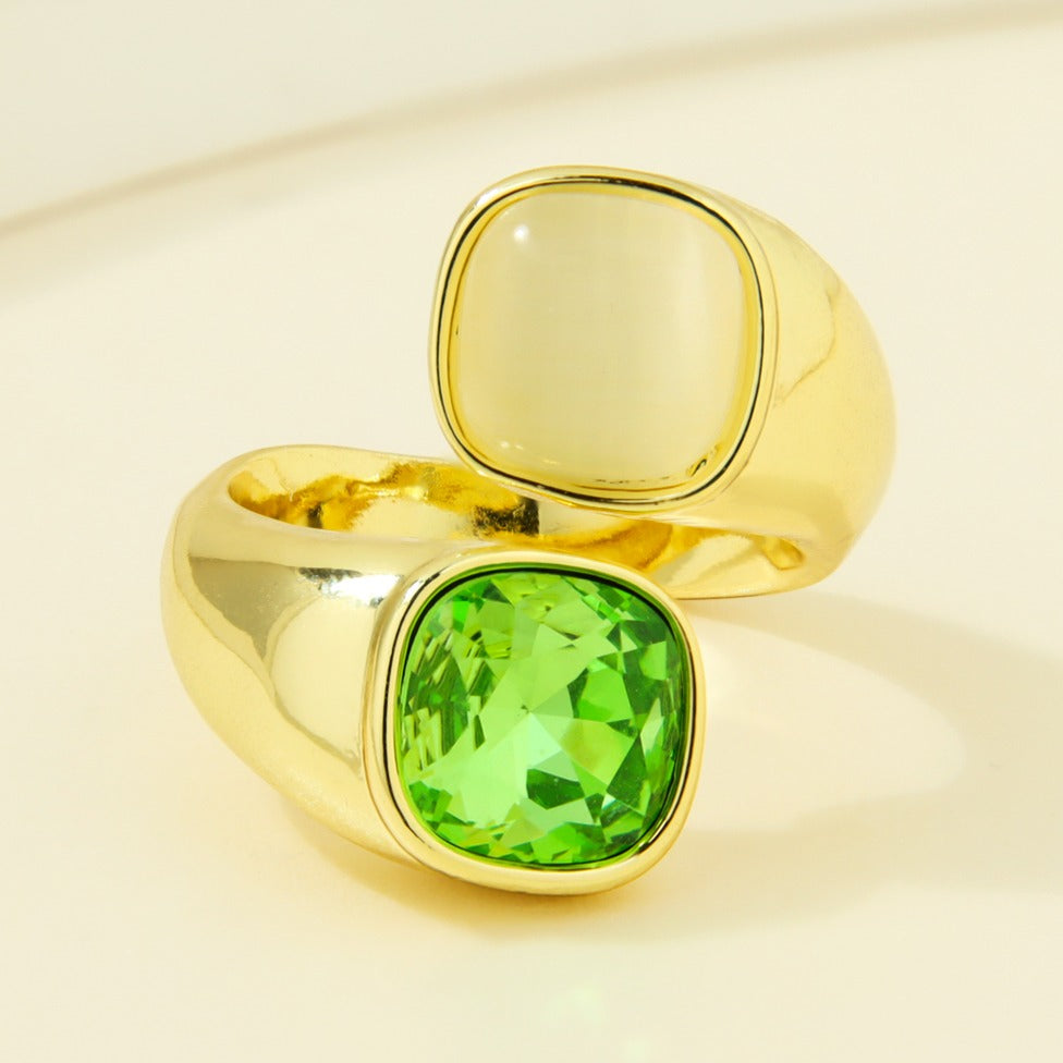 Gold-plated statement ring with cream and green square accents