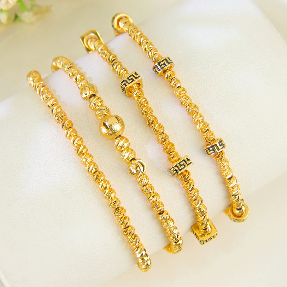 Gold bead charm bracelet