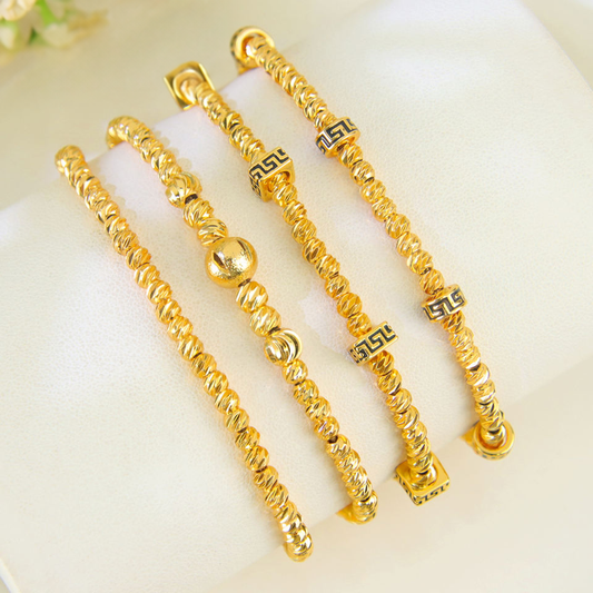 Gold bead charm bracelet